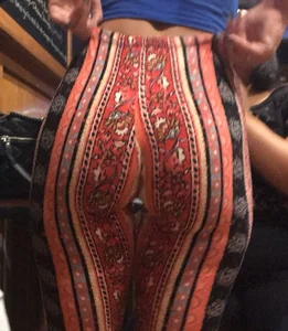 Big fat ass in pattern flare pants with some pokey pierced nipples in a blue crop top