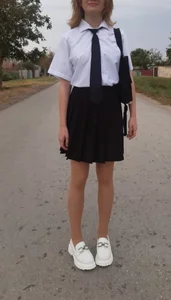 Teen girl's legs in a skirt street photos