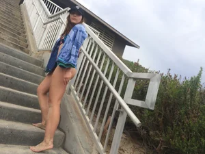 Blue thong beach babe walking up the stairs