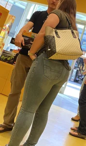 Thick brunette filling out jeans at Lego Store