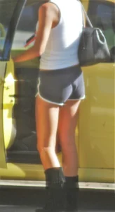 Skinny babe going to her car in little cotton shorts