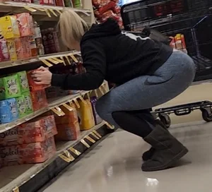 Blonde crouching lower back showing