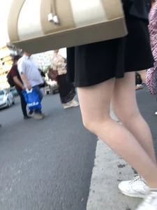 Candid girl wearing a short skirt crossing the street, awesome pale legs