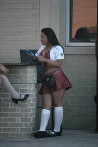 Two sexy Tilted Kilt employees showing cleavage and cheeks