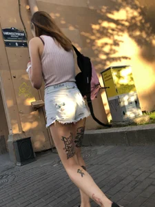 Skinny Girl in Denim Shorts With Fit Tattooed Legs Street Creepshots Gallery
