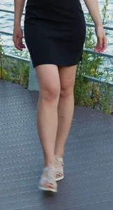Very Nice Candid Legs of a Candid Girl in a Short Skirt Standing on the Embankment