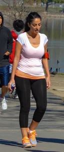 Thick lady walking in leggings with a big booty