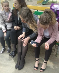 Group of Girls Sitting on a Bench Photo