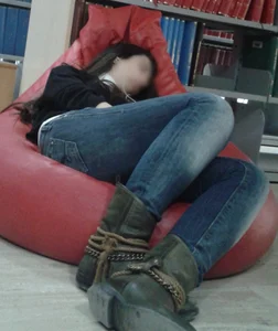 Tall Girl in Tight Blue Jeans And Boots Asleep on the Beanbag at the Library Creepshot