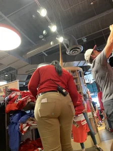 Bunch of girls in various outfits at a Cardinals baseball game