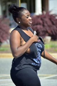 Chubby black lady with big tits and no bra lets it slip