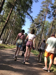 Skinny Teens in Shorts and a Top Walking on a Forest Road Photo Gallery