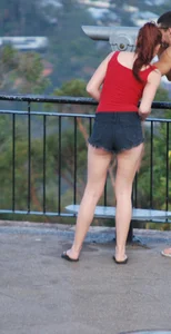 Redhead beauty in short shorts showing some cheeks and panties