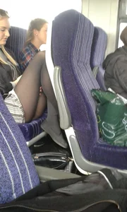 Blonde Sitting in the Bus With Pulled Up Legs in Black Pantyhose