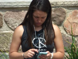 Thick brunette listening to music in shorts