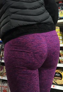 Milf shopping with a nice ass in purple leggings