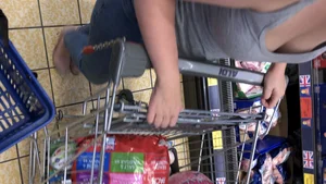 Thick girl showing cleavage while downbloused at the market