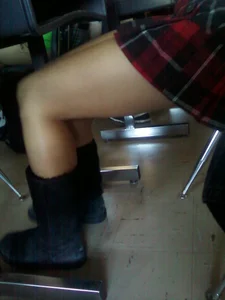 Legs in Boots and a Skirt at the College Auditorium Closeup Creepshot
