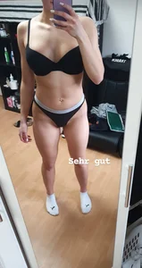 Fit Girl With Muscular Legs and Abs in White Socks and Underwear Mirror Selfie