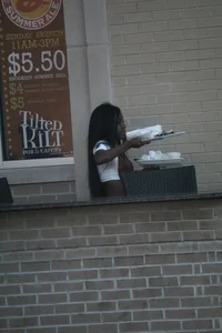 Sexy ebony Tilted Kilt employee in her uniform