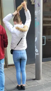 Young girl in tight jeans on the street, hot butt and legs