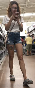 Slim nerd with tats in shorts