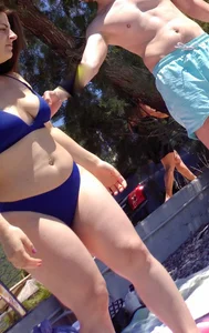 Thick lady at the beach in little blue bikini with big ass