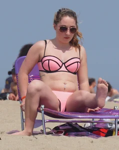 Cute babe in pink and black bikini with a bit of camel toe