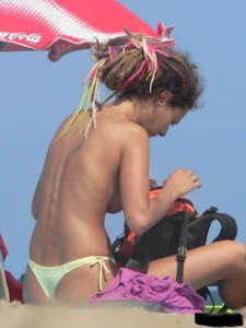 Sexy girls going topless at the beach showing off their sexy bodies