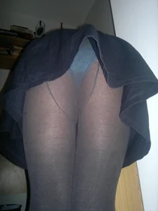 Skinny Girl in a Skirt and Black Pantyhose Bending Over and Flashing Blue Panties Home Creepshot