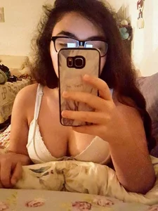 Chubby Bespectacled Girl Taking Selfies in Her Underwear