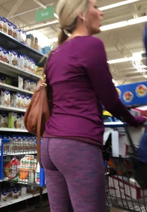 Sexy blonde shopping at Walmart in purple leggings with some vpl