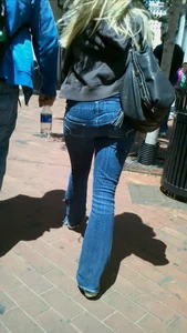 Blonde in tight jeans with her red thong sticking out