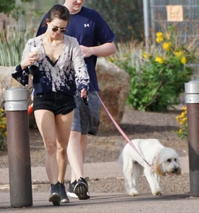 Cutie walking her dog in short denim shorts and showing a bit of cheek