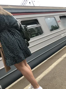 Hot candid girl wearing a dress on a train station platform
