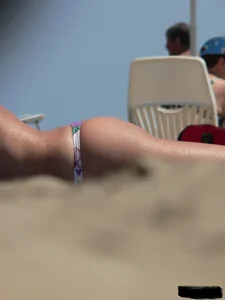 Sexy girls going topless at the beach showing off their sexy bodies