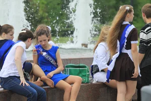 Young College Girls in Dresses, Skirts And Pantyhose Having a Good Time By the City Fountain