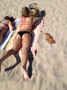 Wet Girl in Swimsuit Lying on Sand Beach Creepshot
