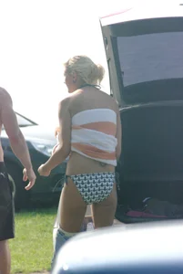 Blonde babe changing into and out of bikini and shows her tits