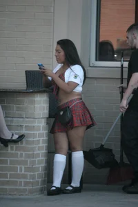 Two sexy Tilted Kilt employees showing cleavage and cheeks
