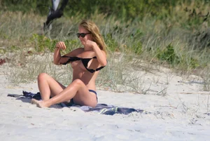 Sexy girls topless on a nude beach showing their nice tits