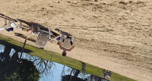 Blonde beach girl with a great ass in pink thong bikini