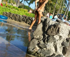 Beach shower girl with cute little ass in tiny black bikini