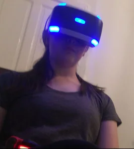 Candid Teen in White Socks And Yoga Pants Sitting With a VR Headset On