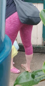 Milf shopping with a nice ass in tight maroon leggings