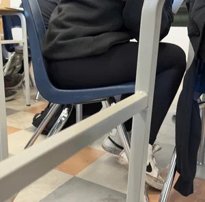 College teen in leggings sitting at her desk in class creepshots