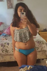 Chubby Bespectacled Girl Taking Selfies in Her Underwear
