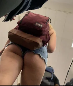 Yummy big booty hanging out for everyone to see in denim shorts