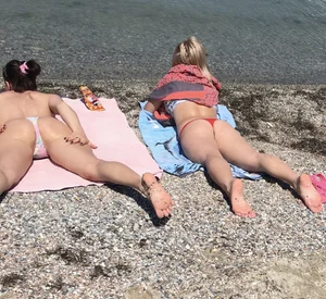 Large collection of hot beach girls lying on the beach and bending over