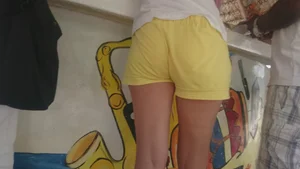 Milf in yellow shorts with vpl and a wedgie